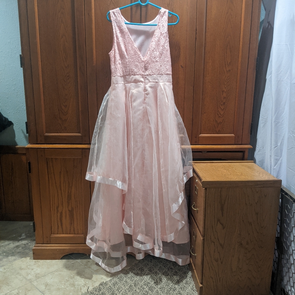 This is a light pink prom dress if anybody is interested